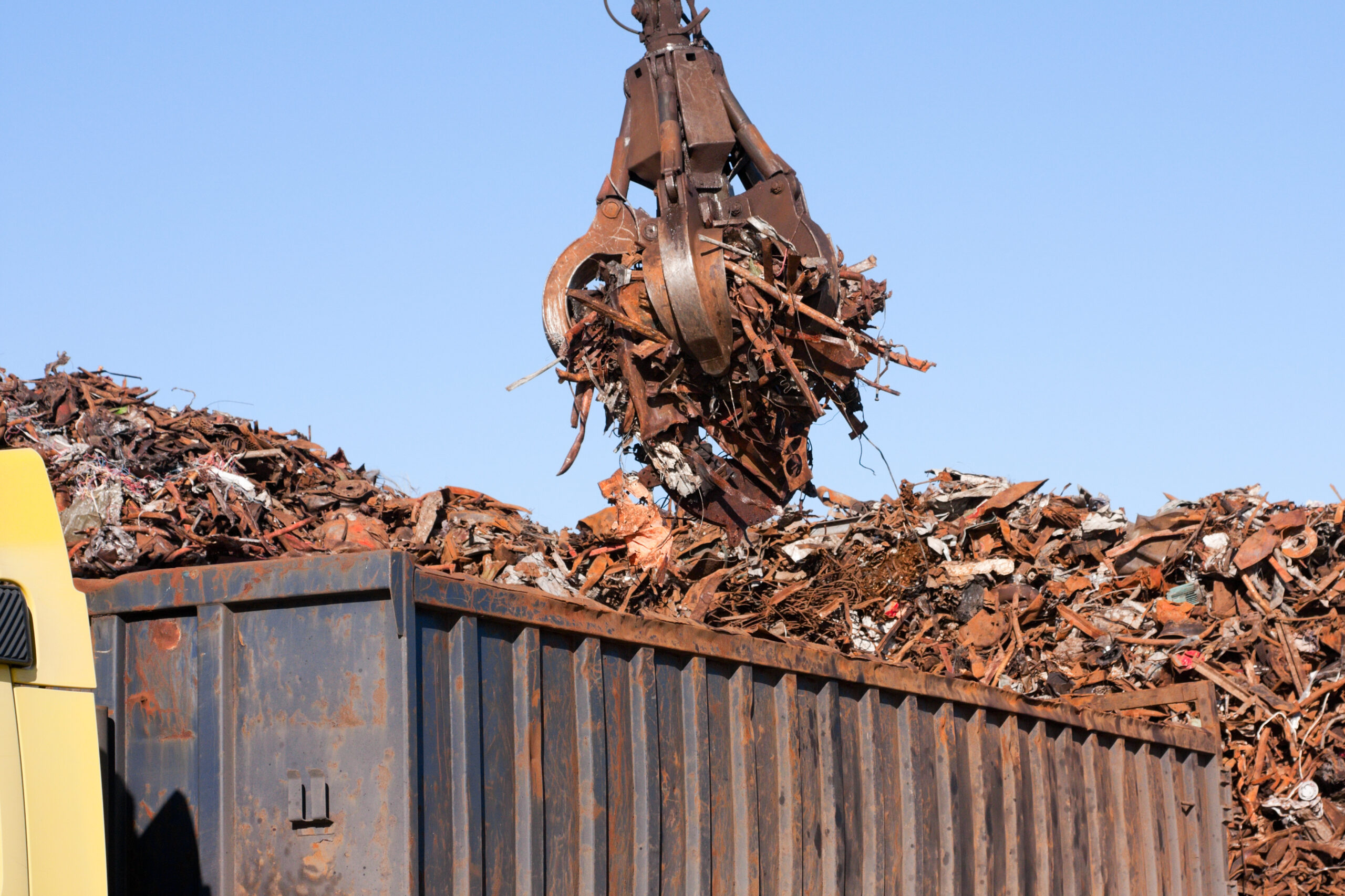 Crane grabber loading industrial scrap metal